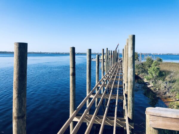 Marine Construction project in progress - new wood dock installation in Bay County | Inland Construction & Engineering, Inc. Panama City, Florida providing construction, general contracting, marine construction, design & engineering, diving services, roofing, & bulding rehab.